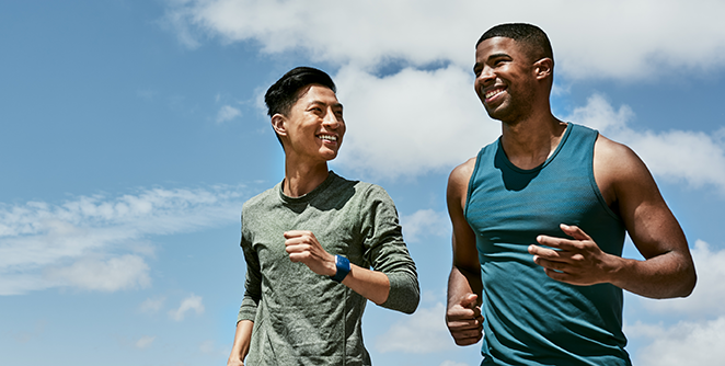 Two men running and smiling