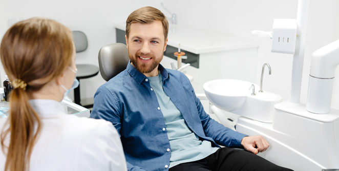 dentist and patient smiling